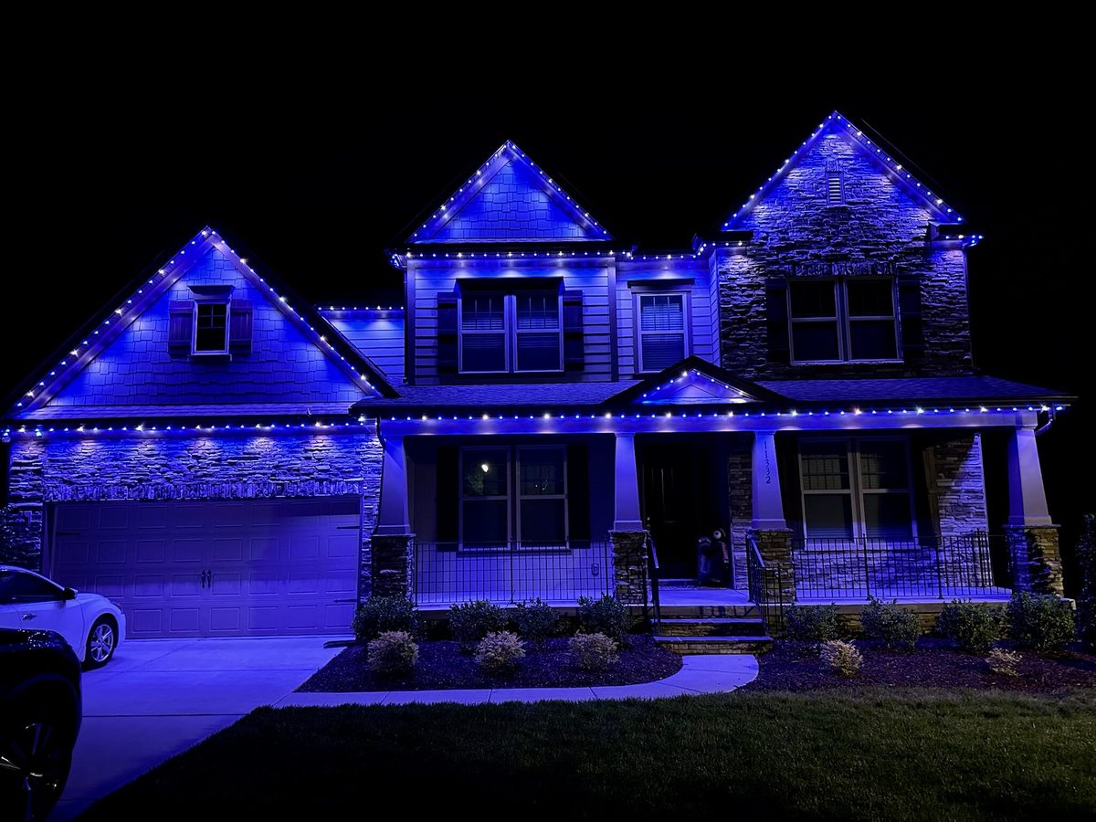Home lit in blue permanent lighting for game day