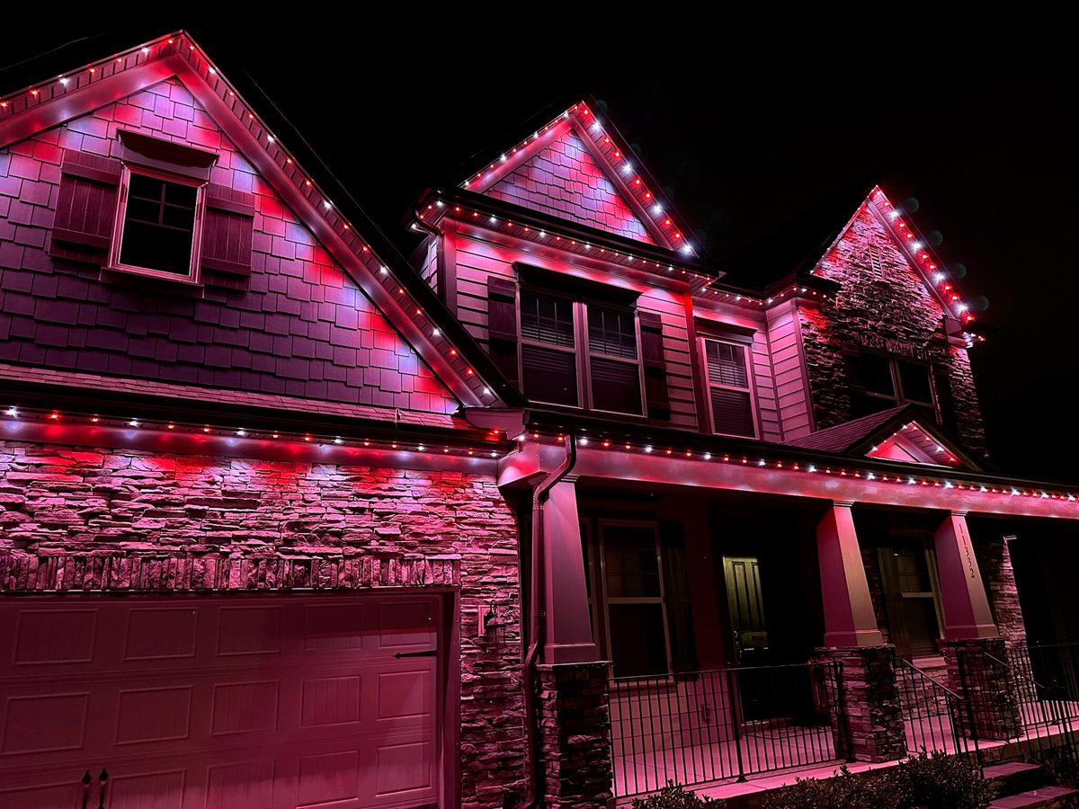 Home lit in bold red permanent lighting